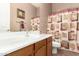 Bathroom with a sink, mirror, decorative shower curtain, and toilet at 2945 E Clifton Ave, Gilbert, AZ 85295