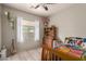 Bright bedroom with a ceiling fan, natural light, and unique decor at 2945 E Clifton Ave, Gilbert, AZ 85295