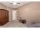 Bedroom with a ceiling fan, closet, wooden furniture, and a beanbag chair at 2945 E Clifton Ave, Gilbert, AZ 85295