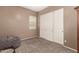 Bedroom featuring carpet, blinds, and a large closet with sliding doors at 2945 E Clifton Ave, Gilbert, AZ 85295