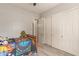 Cozy bedroom with gray walls, wood-look flooring, and closet at 2945 E Clifton Ave, Gilbert, AZ 85295