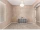Bright dining room with neutral walls, stylish chandelier, neutral carpet, and ample natural light at 2945 E Clifton Ave, Gilbert, AZ 85295