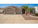 Charming single-story home featuring a spacious three-car garage and desert landscaping at 2945 E Clifton Ave, Gilbert, AZ 85295