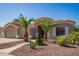 Front exterior of a home featuring desert landscaping and mature palm trees at 2945 E Clifton Ave, Gilbert, AZ 85295