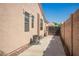 Exterior view of the house showing the side yard and access gate at 2945 E Clifton Ave, Gilbert, AZ 85295