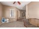 Cozy living room with neutral paint, plush sofa, and a window providing natural light at 2945 E Clifton Ave, Gilbert, AZ 85295