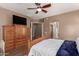 Spacious primary bedroom with hard surface flooring, a ceiling fan, and an expansive closet at 2945 E Clifton Ave, Gilbert, AZ 85295