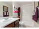 Bathroom featuring a single vanity, a bath and shower combination, and colorful decor at 29506 N 21St Ave, Phoenix, AZ 85085