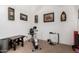 Carpeted exercise room includes a stationary bike and space for light workouts at 29506 N 21St Ave, Phoenix, AZ 85085