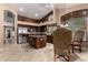 Well-equipped kitchen featuring dark wood cabinetry, granite countertops, and stainless steel appliances at 29506 N 21St Ave, Phoenix, AZ 85085