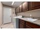 Functional laundry room with front-load washer and dryer and plenty of cabinet space at 29506 N 21St Ave, Phoenix, AZ 85085