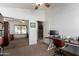 Cozy office space offering neutral carpet, a desk and chair, and a mirrored closet with ample storage at 29506 N 21St Ave, Phoenix, AZ 85085