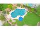 Aerial view of a backyard pool with a diving board, surrounded by lush landscaping at 29506 N 21St Ave, Phoenix, AZ 85085