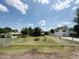A cozy home surrounded by a classic white picket fence, trees and well-maintained greenery at 3215 W Orangewood Ave, Phoenix, AZ 85051