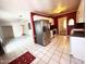 Spacious kitchen featuring white appliances, tile floors, and white cabinetry at 3215 W Orangewood Ave, Phoenix, AZ 85051
