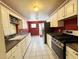 Functional kitchen with stainless steel appliances, white cabinets, and a spacious layout at 3215 W Orangewood Ave, Phoenix, AZ 85051