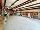 Open interior with concrete floor, shelving, and a rolling ladder at 3215 W Orangewood Ave, Phoenix, AZ 85051