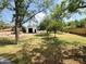 Exterior view of an outbuilding in a spacious lot with trees, providing shade and privacy at 3215 W Orangewood Ave, Phoenix, AZ 85051