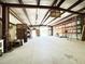 Bright workshop featuring a large open area, metal beams, and a clear view of the entrance at 3215 W Orangewood Ave, Phoenix, AZ 85051