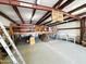 Spacious workshop with metal beams and ample space for storage or various projects at 3215 W Orangewood Ave, Phoenix, AZ 85051