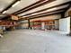 Spacious workshop featuring steel beams, shelving, and ample room for projects and storage at 3215 W Orangewood Ave, Phoenix, AZ 85051
