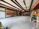 Expansive workshop with steel beams, high ceilings, and plenty of room for storage and equipment at 3215 W Orangewood Ave, Phoenix, AZ 85051