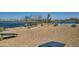 A beautiful community area with a lake, playground, and picnic tables at 3283 E Outlaw Ln, San Tan Valley, AZ 85140