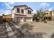 Two-story home featuring a stucco exterior, attached two-car garage, and a concrete driveway at 3491 N 301St Dr, Buckeye, AZ 85396