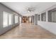 Open-concept living area with tiled floors, abundant natural light, and a ceiling fan for added comfort at 3491 N 301St Dr, Buckeye, AZ 85396