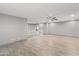 Bright and airy loft area featuring tile flooring and a view of the staircase and downstairs area at 3491 N 301St Dr, Buckeye, AZ 85396
