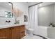 Bright bathroom featuring a modern vanity, decorative mirror, and stylish tile flooring at 3502 N Rose Circle Dr, Scottsdale, AZ 85251