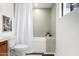Bright bathroom with white shower curtain and neutral-colored tiling around a tub at 3502 N Rose Circle Dr, Scottsdale, AZ 85251