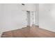 Spacious bedroom with hardwood floors, neutral walls, and a sliding door closet at 3502 N Rose Circle Dr, Scottsdale, AZ 85251