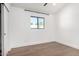Minimalist bedroom with hardwood floors, modern trim, and a sliding door closet at 3502 N Rose Circle Dr, Scottsdale, AZ 85251