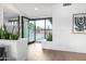 Bright entryway with modern accents, beautiful wood floors, and plants at 3502 N Rose Circle Dr, Scottsdale, AZ 85251