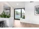 Bright entryway with modern accents, beautiful wood floors, and plants at 3502 N Rose Circle Dr, Scottsdale, AZ 85251