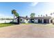 Contemporary home featuring a well-manicured lawn, spacious driveway, and modern architectural details at 3502 N Rose Circle Dr, Scottsdale, AZ 85251