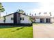Charming single-story home with a modern design, manicured lawn and spacious driveway at 3502 N Rose Circle Dr, Scottsdale, AZ 85251