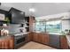 This home features a gorgeous kitchen with wooden cabinets, open shelves, and stainless steel appliances at 3502 N Rose Circle Dr, Scottsdale, AZ 85251