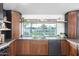 Kitchen with stainless steel appliances and a picturesque window that looks out to the beautiful yard at 3502 N Rose Circle Dr, Scottsdale, AZ 85251