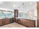 The kitchen has a center island, wooden cabinets, and updated appliances at 3502 N Rose Circle Dr, Scottsdale, AZ 85251