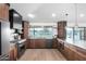 A large kitchen with a center island, stainless steel appliances, and light wood flooring is great for entertaining at 3502 N Rose Circle Dr, Scottsdale, AZ 85251