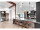 Open concept kitchen features a large island with bar seating and custom cabinets at 3502 N Rose Circle Dr, Scottsdale, AZ 85251