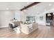 Spacious open-concept living area boasting high ceilings and hardwood floors with stylish decor at 3502 N Rose Circle Dr, Scottsdale, AZ 85251