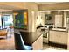 Well-lit kitchen with stainless steel appliances, mirrored backsplash and modern decor at 351 E Thomas Rd # D106, Phoenix, AZ 85012