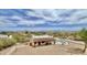 Aerial view of a backyard with a pool and a tiled patio looking out to the mountains at 36721 N 17Th Ave, Phoenix, AZ 85086