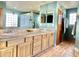 Bright bathroom with double sinks, wood cabinets, tiled floors, and lots of light at 36721 N 17Th Ave, Phoenix, AZ 85086