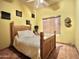 Cozy bedroom with hardwood floors, natural light, and simple decor at 36721 N 17Th Ave, Phoenix, AZ 85086