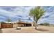 Expansive desert property featuring neutral stucco home, covered patio, fire pit, and natural landscaping at 36721 N 17Th Ave, Phoenix, AZ 85086