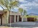 A three car garage, wooden fence, desert landscaping and mountain views at 36721 N 17Th Ave, Phoenix, AZ 85086